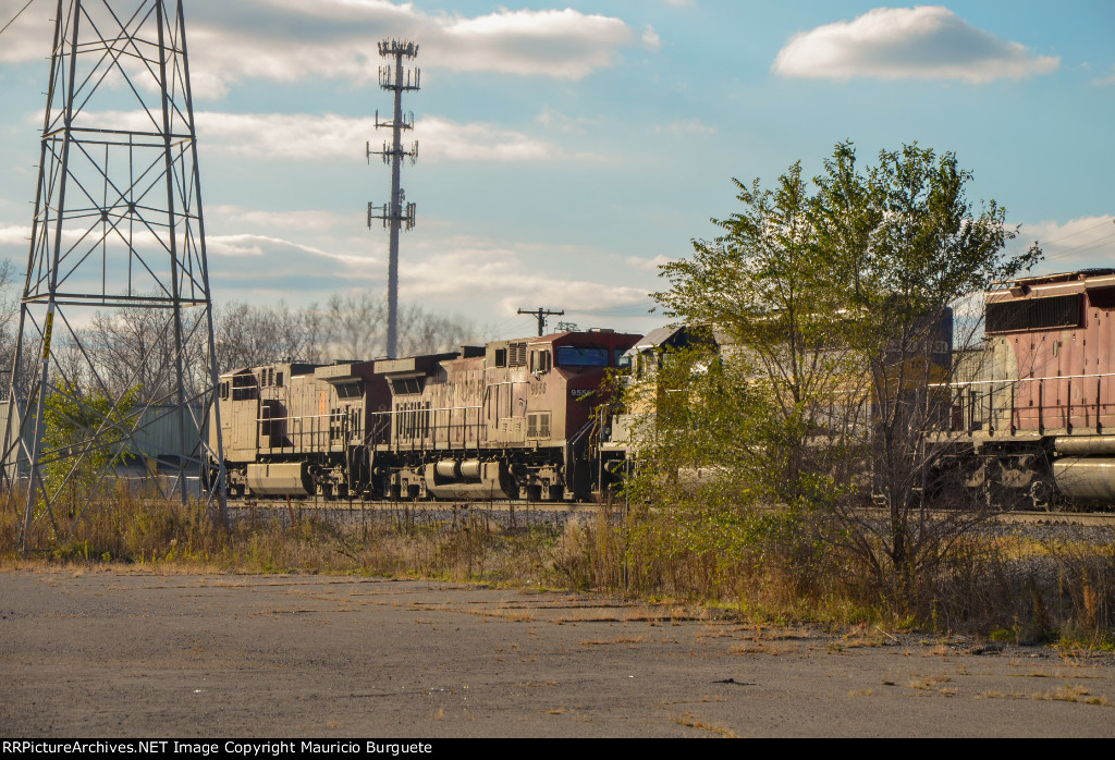 CP AC44CW Locomotives leading a train